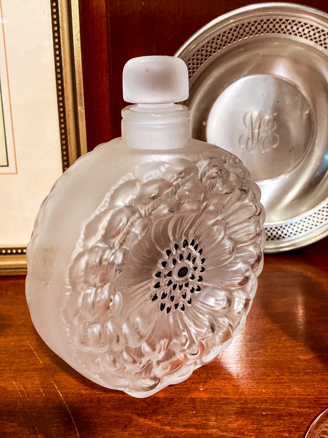 Art Nouveau Lalique perfume bottle with floral design